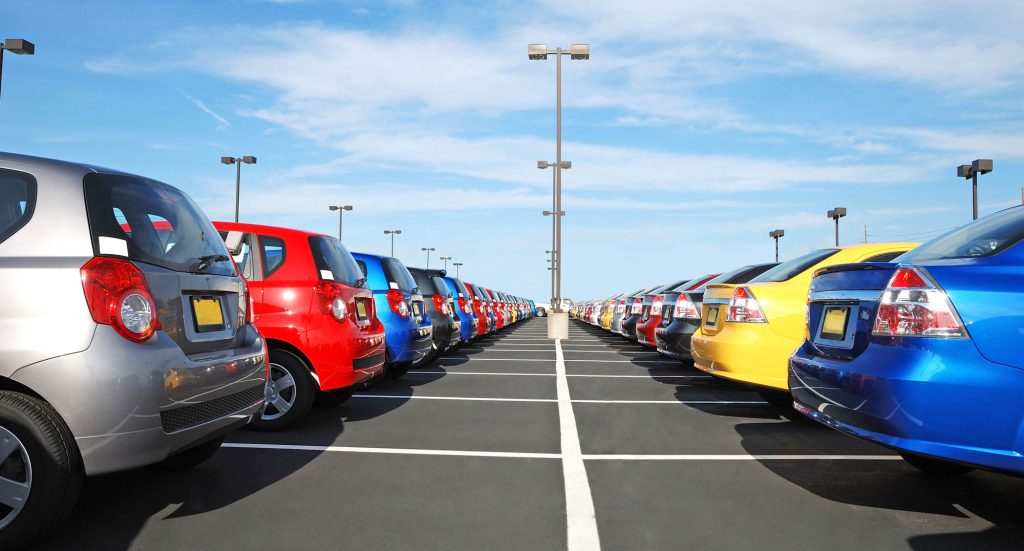 new cars in the parking lot in the automobile dealership