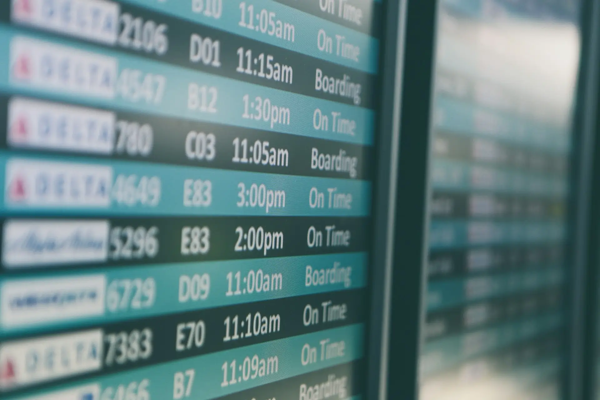 close up of screen listings flights at an airport