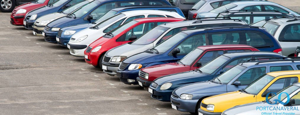 View of a parking lot with many cars in rows