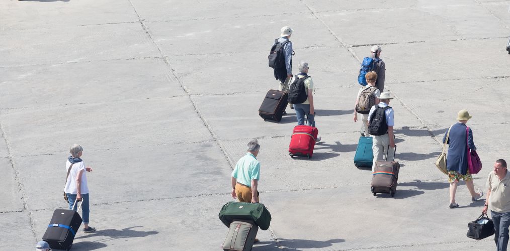 Passengers disembarking from a cruise ship