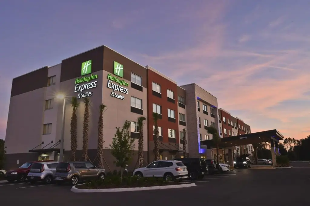 Exterior of Holiday Inn Express Lake Nona hotel with sky at dusk