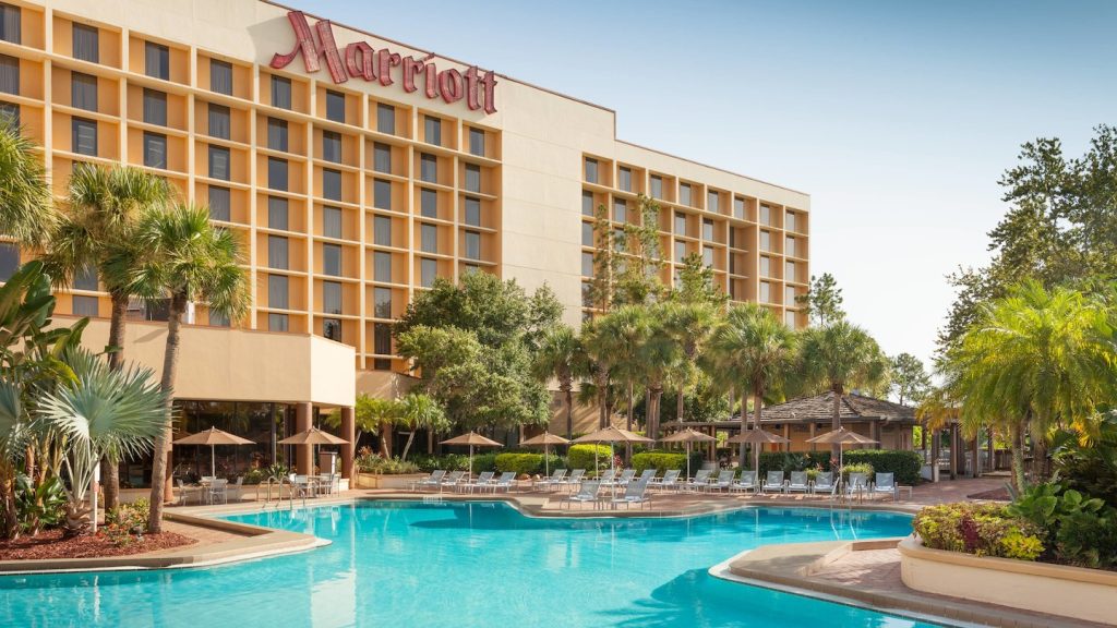 Exterior view of Marriott Orlando Airport with swimming pool out front