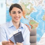 Travel agent handing passports and tickets to couple